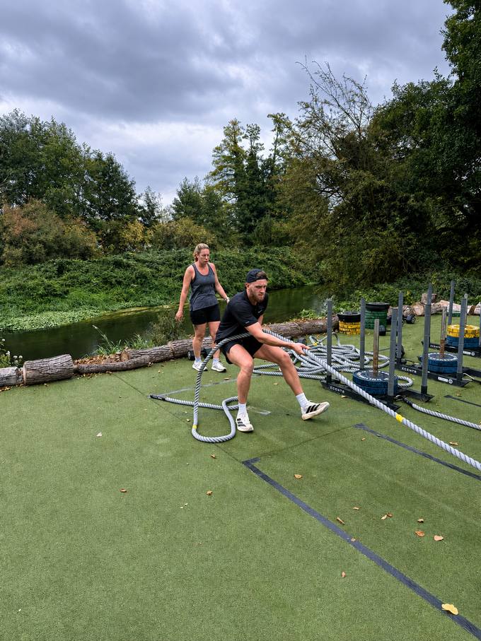 Battle-rope training at an outdoor BODY HEALTH FITNESS session