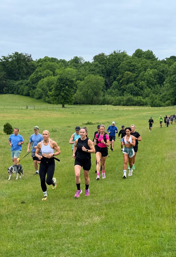 BHF Run Club members running together through open grassland